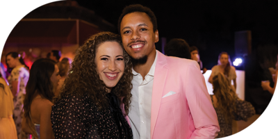 husband and wife posing at a Gala