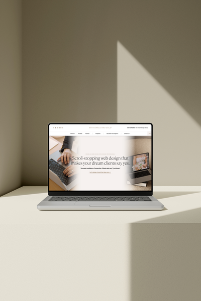 A laptop mockup showing Showit website templates from award-winning web designers, With Grace and Gold 