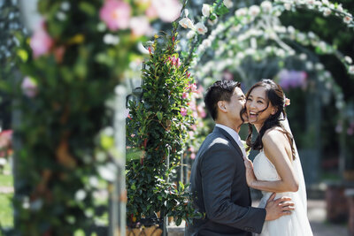 The Grove | Bride laughing as groom whispers during summer wedding | Cedar Grove, New Jersey