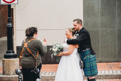 New England wedding photographer directing a couple
