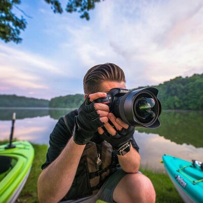 Ohio photographer in  Aaron Aldhizer, kayaking and taking photos in Hudson Springs, a park in Hudson Ohio.