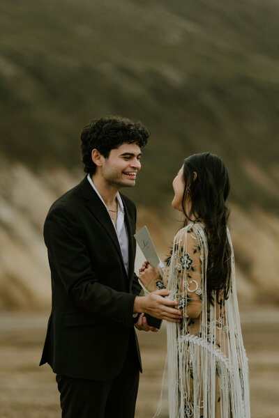 couple exchanging vows during Iceland elopement