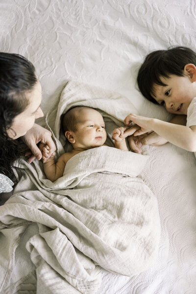 newborn couple in nursery