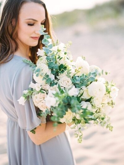 sf bay area photographer holding bouquet of flowers