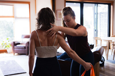 Dr. Parkar Price listening to a client during a one-on-one consultation focused on integrative physical therapy in Bend, Oregon.