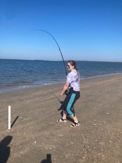 Brunette Women fishing on Edisto Beach