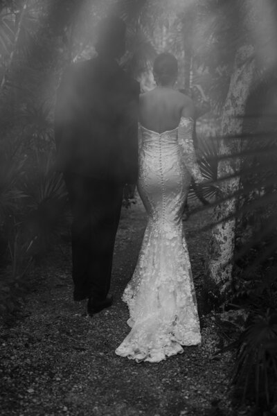 Film photo in black and white of a couple walking away side by side