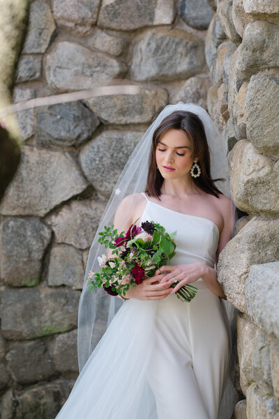 bride putting on earrings