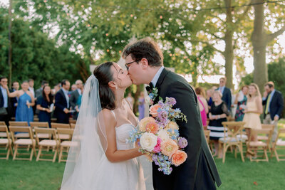 A couple kisses at their Terrain Glen Mills Wedding.