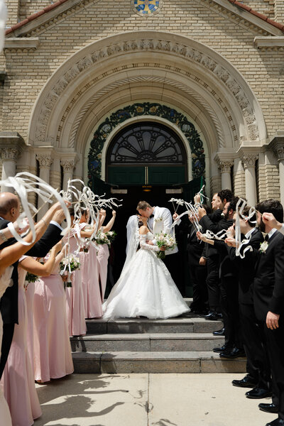 bride and groom in texas near water fountain captured by texas wedding photographer
