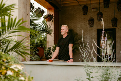 Professional dating profile photo featuring a client in a relaxed urban setting.