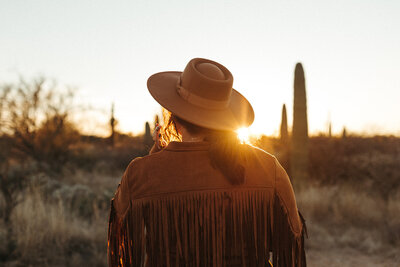 women watching the sunset in the desert