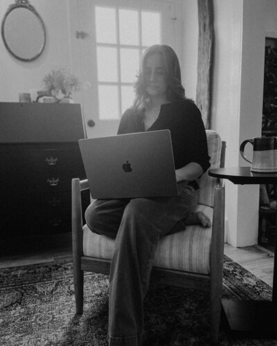 web designer working on laptop from home