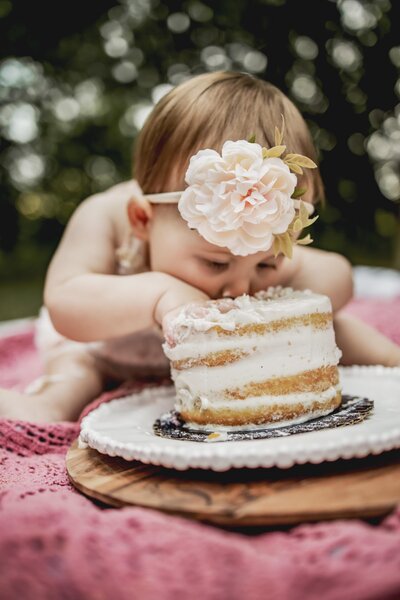 baby eats a cake on one year birthday