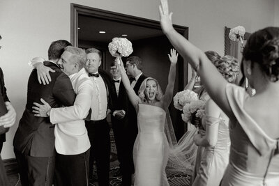 Photo of bride after her ceremony celebrating with her bridal party