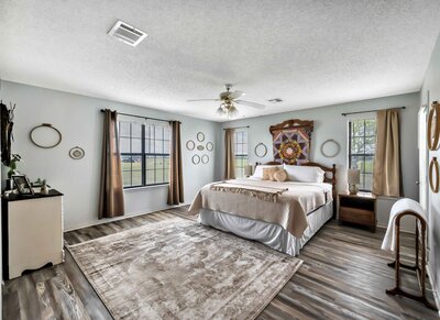 Master bedroom with two closets and private bathroom in this 3-bedroom, 2.5 bathroom rural vacation rental house just minutes outside of downtown Waco, TX.