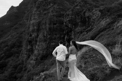 bride and groom looking over shoulder