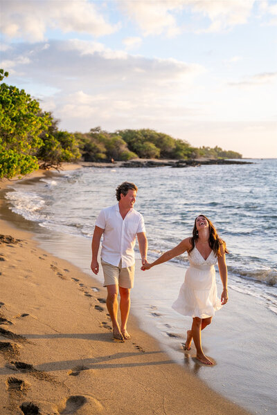 Beach engagement photos with couple on a white sandy in Waikoloa, taken by hawaii engagement photographer