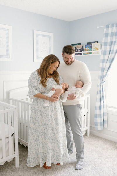 Beautiful nursery with crib, rocker, and cushion with natural light pouring in