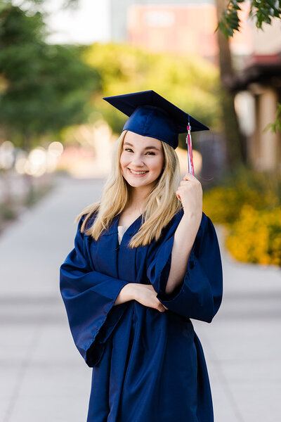 High school senior with navy blue cap and gown