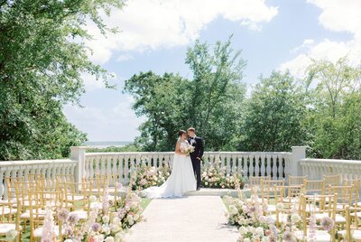 bride and groom embracing in garden