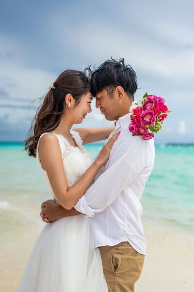 bride and groom on their wedding day on a beach