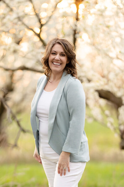 Award-winning photographer Amanda Gibson of Gibson Photography in the cherry blossoms Burlington, Ontario.