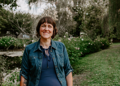 Erin, therapist at First Star, smiles into the distance