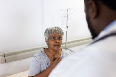 concerned-biracial-senior-female-patient-talking-t-2023-11-27-05-00-35-utc
