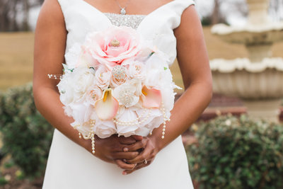 African American Bride Holding Pink and White Bouquet