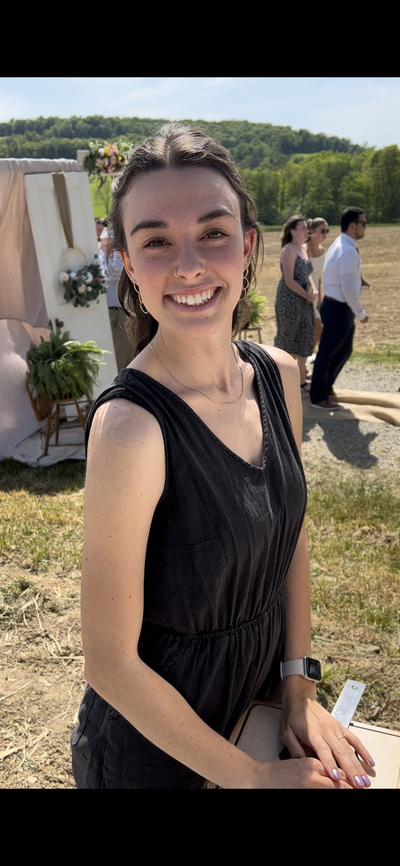 Live Wedding Painter smiling while at a ceremony