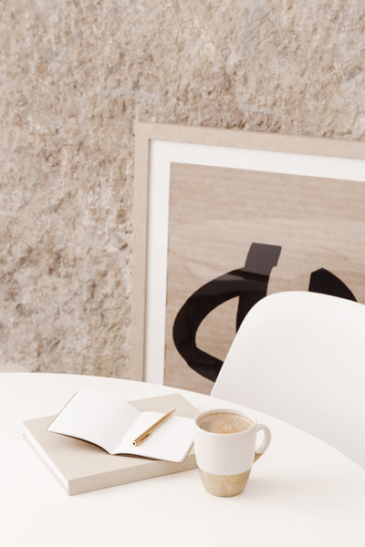 White desk with notebook and coffee
