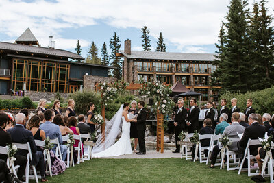 Elegant outdoor ceremony at Azuridge Estate Hotel, sophisticated and romantic Foothills, Alberta wedding venue, featured on the Brontë Bride Vendor Guide.