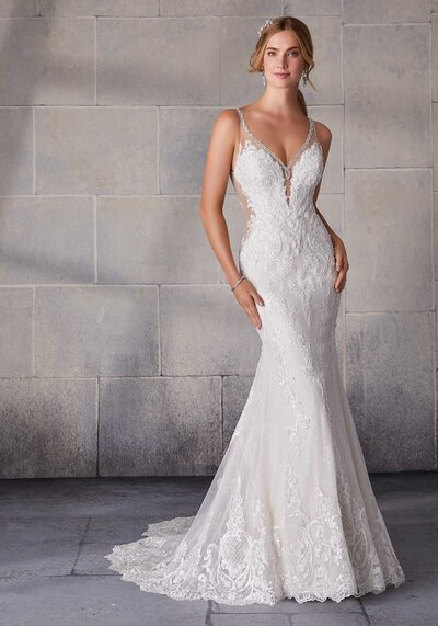 For brides of the effortlessly cool persuasion, we present a unique lace bridal dress featuring a flattering neckline and a shimmery statement back.