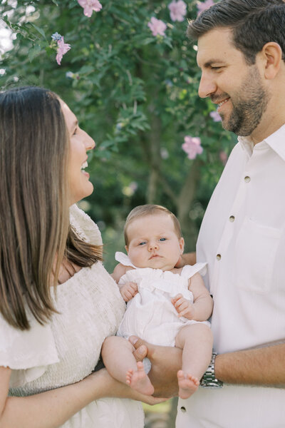 Same bride and groom from above a couple of years later with their newborn daughter