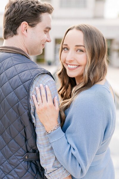 Smiling couple looking over shoulders | Alabama wedding photographer Amanda Horne