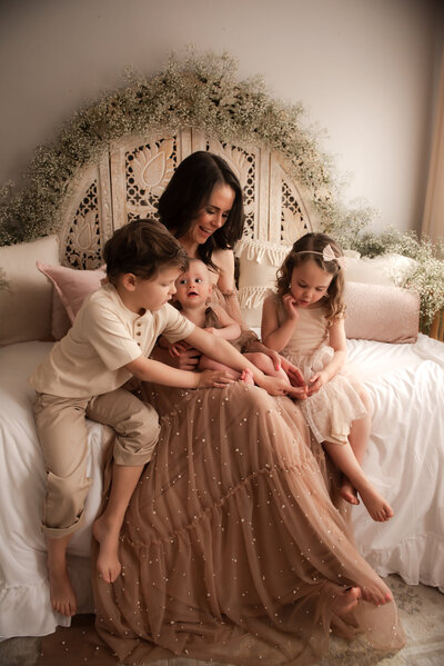 A mother and her three children at Hope Louise's in home studio.