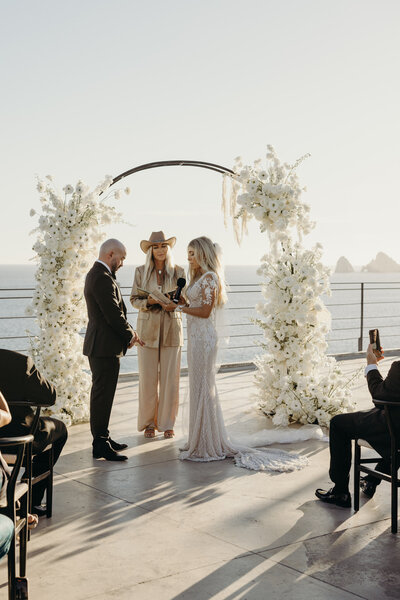Ceremony at the Cape rooftop, White flowers design by MemoryBox Photography
