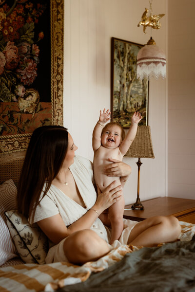 mothers day mini photography sessions at linnings house, twigley farm, mother and daughter sitting on the bed