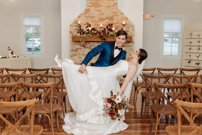 Romantic 'Dip of Love' elopement photo captured by Style & Grace Photography at 1860 Schulaus, Defiance, MO, showcasing a passionate moment between the couple.