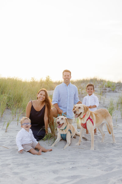 family of four with dogs beach photo session in Ocean City, NJ by Magdalena Studios