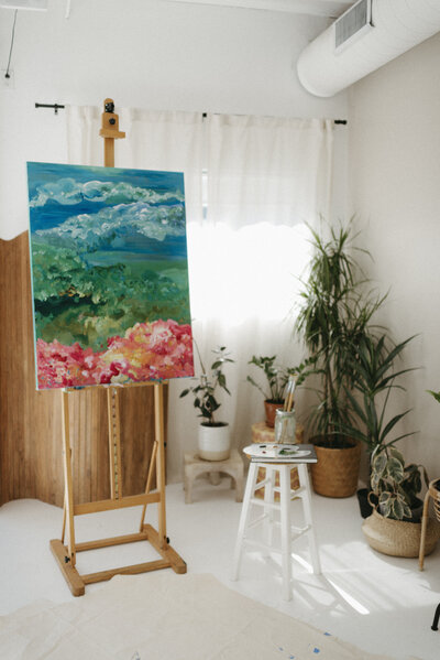an easel with a painting in a Scottsdale studio