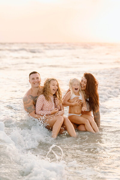 a family laughs during their 30a photography session