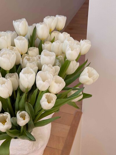 bouquet of white wedding tulips in vase