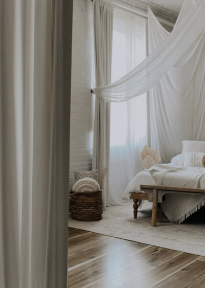 Studio image infant bassinet with white bedding in boho background in Tampa Bay, Florida Nadine B Photography