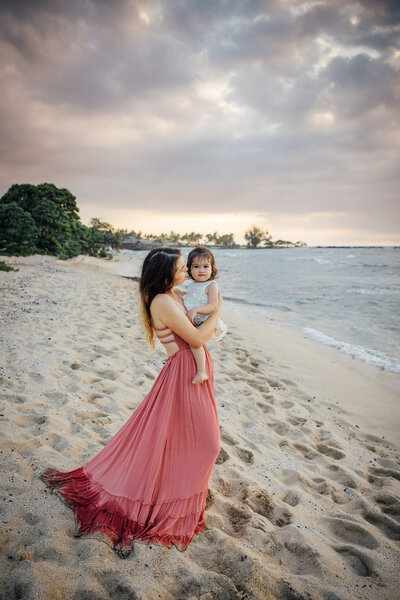 mom with babe photographed on Big Island Beach