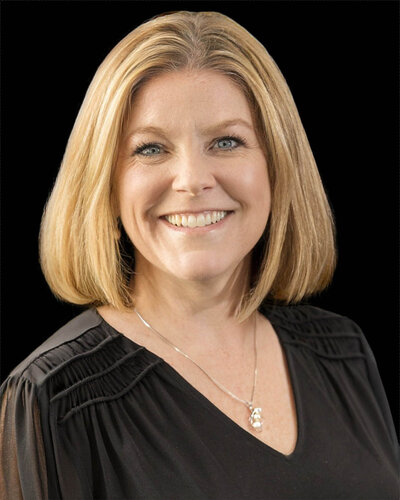 Britney Reddy a female commercial appraiser in Wyoming smiling at the camera
