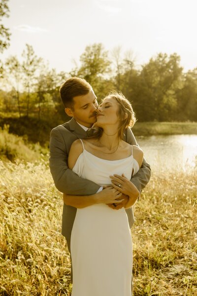 Golden hour portraits of a bride and groom at Walnut Ridge Venue in Shellsburg, Iowa.