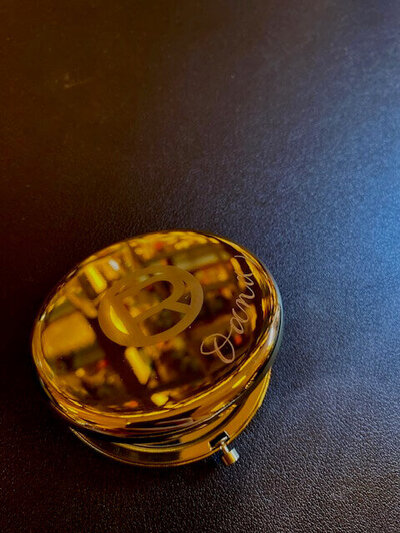 gold mirror with engraved name