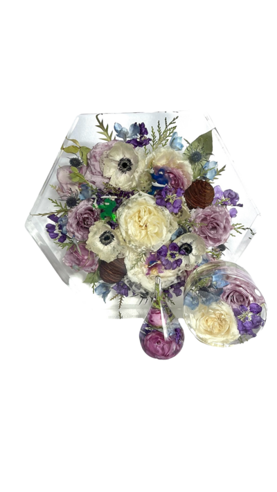 groom sitting next to bride holding bright and beautiful bouquet made by Buds Blooms and Blossoms